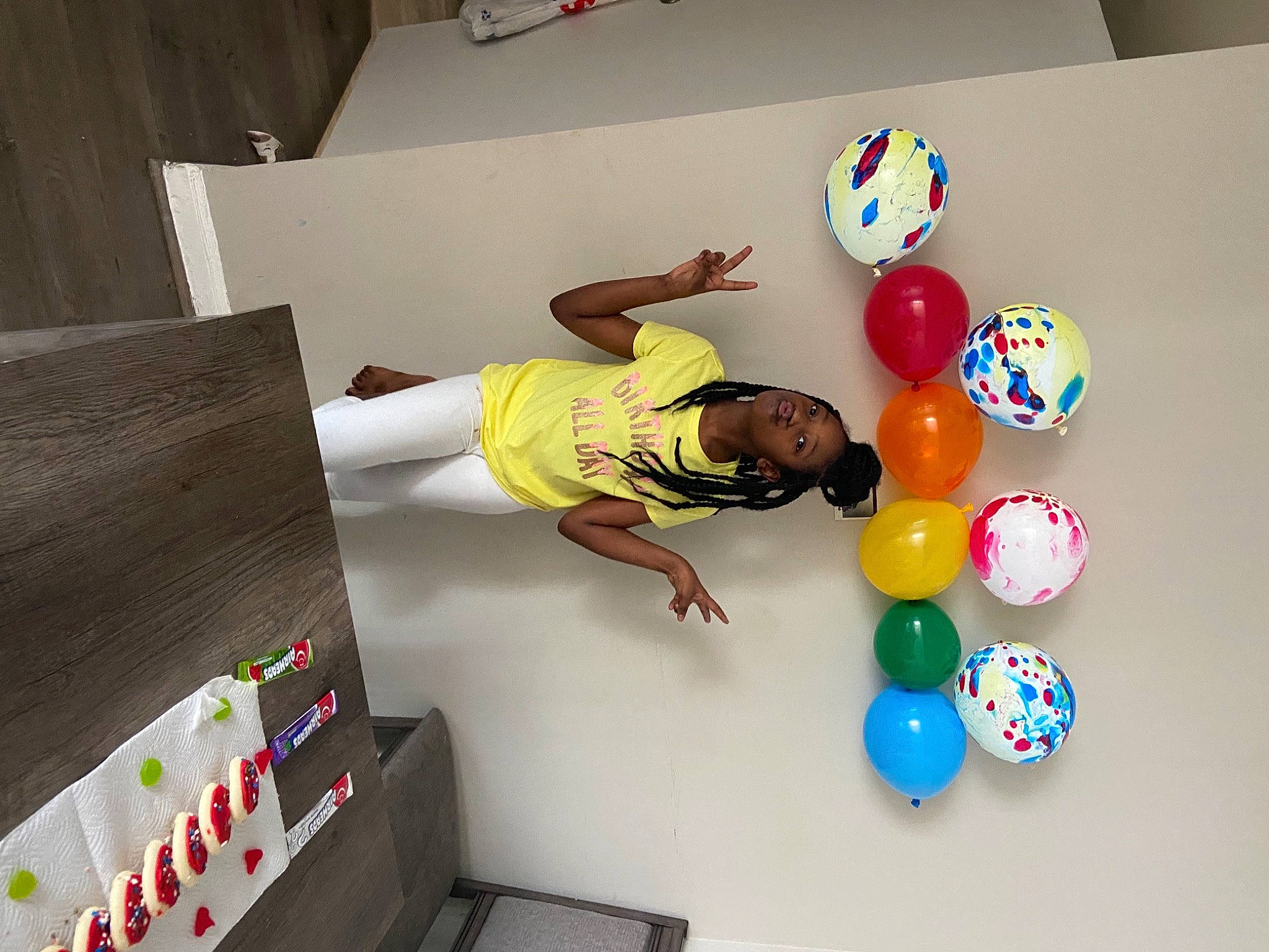 Ivy is registered to the contest to win money with this photo: art, balloon, ceiling, child, circle, flooring, fun, graphic_design, machine, party_supply, person, plastic, play, product, room, space, t_shirt, toy, visual_arts, world