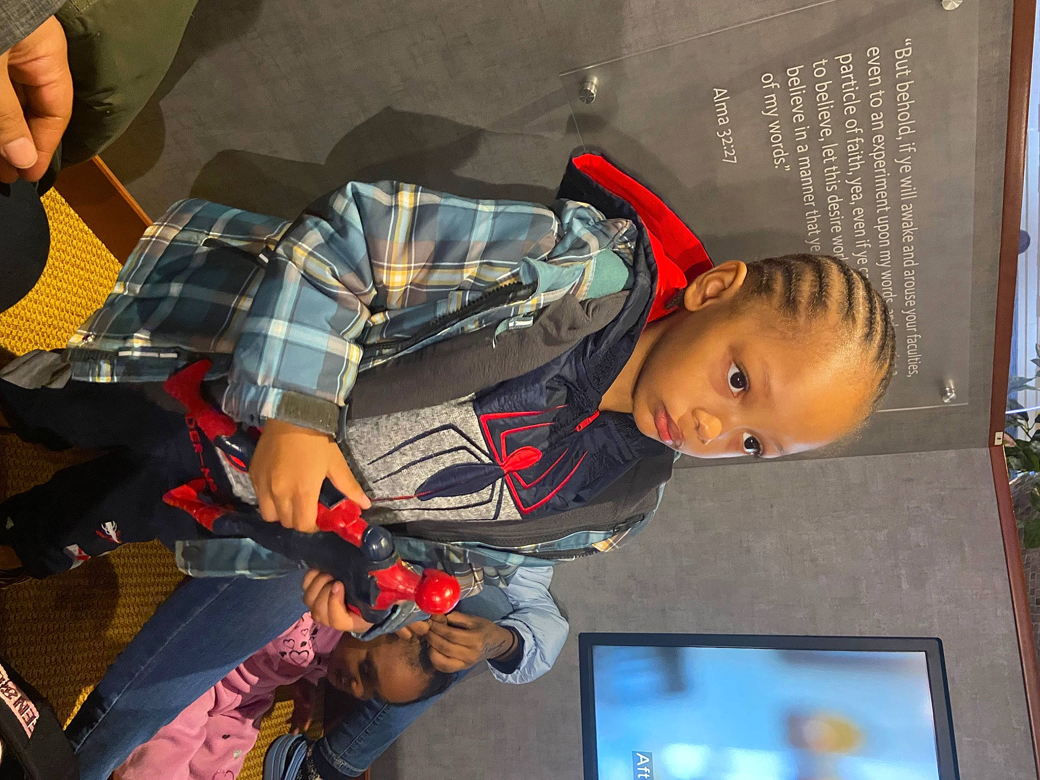 Tyler is registered to the contest to win money with this photo: carmine, child, fun, pattern, person, photograph, photography, plaid, room, snapshot, space, tartan, toddler, tree, world