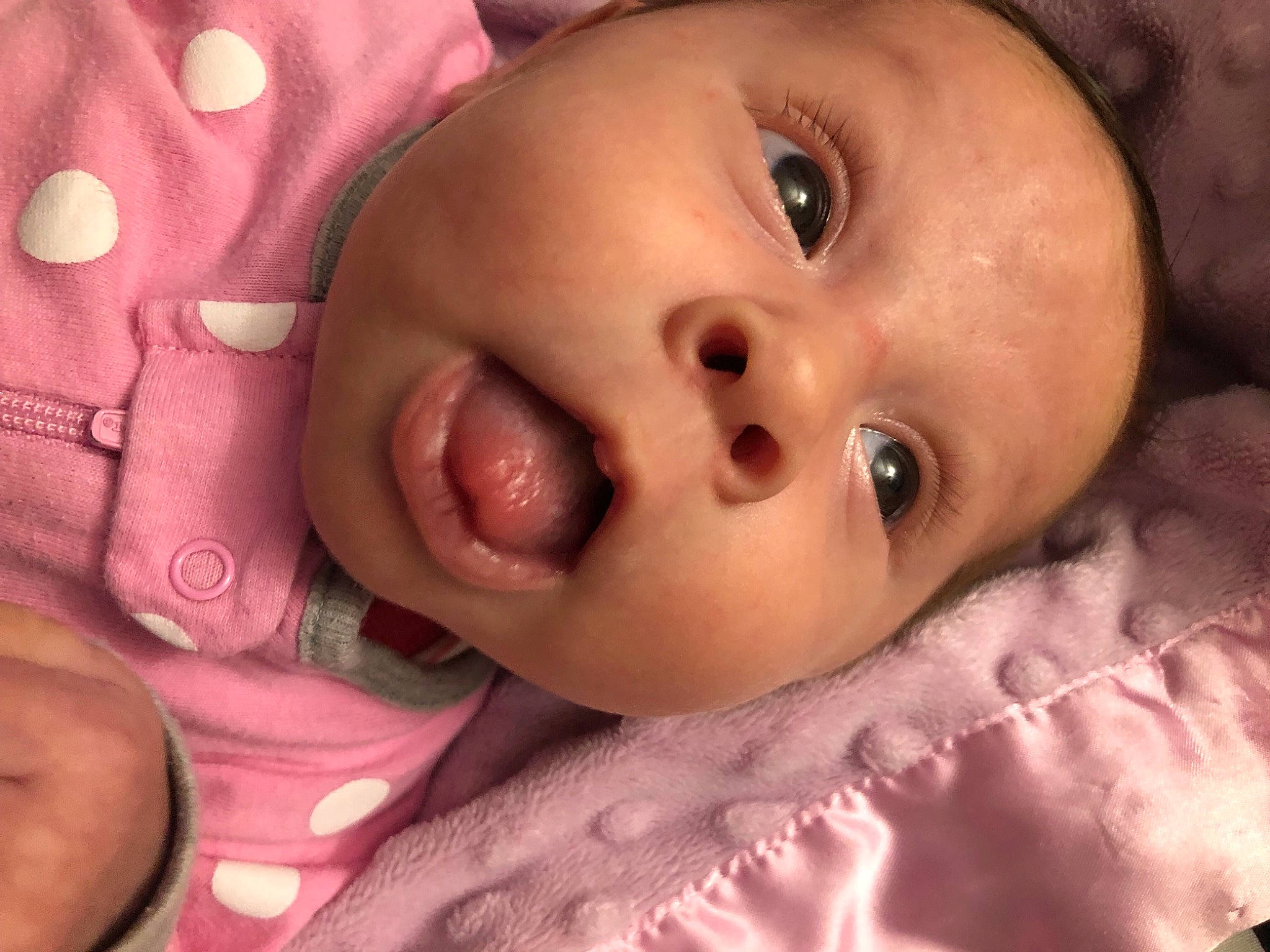 Ailani is registered to the contest to win money with this photo: baby, cheek, child, chin, eye, eyebrow, eyelash, facial_expression, finger, forehead, gesture, happy, human_body, iris, lip, mouth, nose, person, pink, skin