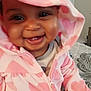 Reina joined the competition — help win amazing prizes! baby, child, hoodie, pink, heart_pattern, smiling, teeth, indoor, bed, blanket, happy, cute, person, clothing, face, portrait, infant, young_child, warm, cozy