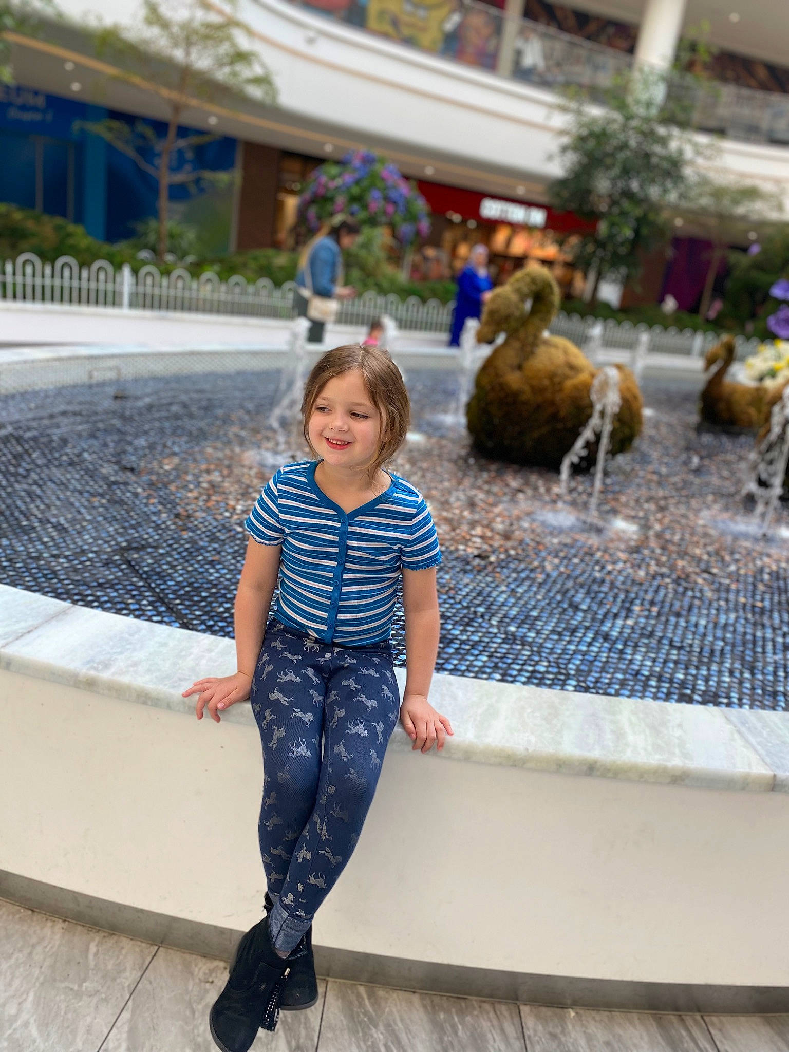 Elise joined the competition — help win amazing prizes! child, city, daytime, denim, electric_blue, fountain, fun, happy, human_leg, joy, leisure, person, plant, recreation, sitting, smile, toddler, tourism, travel, vacation