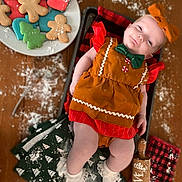 Ivory joined the competition — help win amazing prizes! baby, infant, child, gingerbread_outfit, bow, smile, cookies, holiday_cookies, christmas_cookies, baking_tray, rolling_pin, flour, table, kitchen_towels, festive, red, green, white, cute, holiday