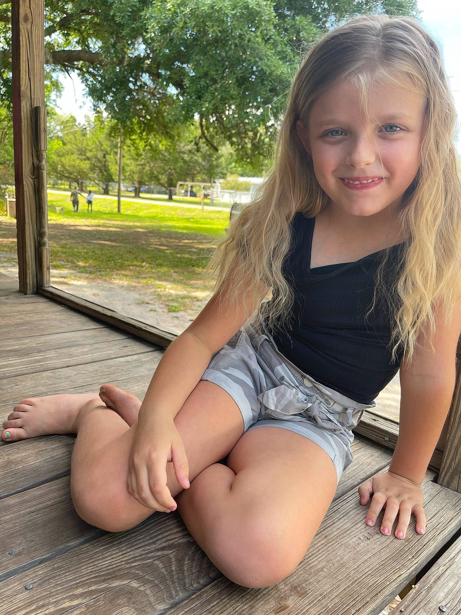 Kaia is registered to the contest to win money with this photo: eye, face, facial_expression, flash_photography, grass, hairstyle, happy, joy, knee, leg, leisure, long_hair, muscle, person, plant, shorts, shoulder, skin, smile, sunlight