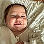 Tayler joined the competition — help win amazing prizes! baby, smile, face, hand, white_clothing, blanket, infant, cute, portrait, child, soft_texture, lying_down, cozy, happy, indoors, young_child, skin, head, closeup, cheeks