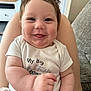 baby, smile, infant, cute, happy, chubby, face, person, clothing, sitting, indoor, home, couch, arm, legs, shirt, tongue, skin, head, portrait