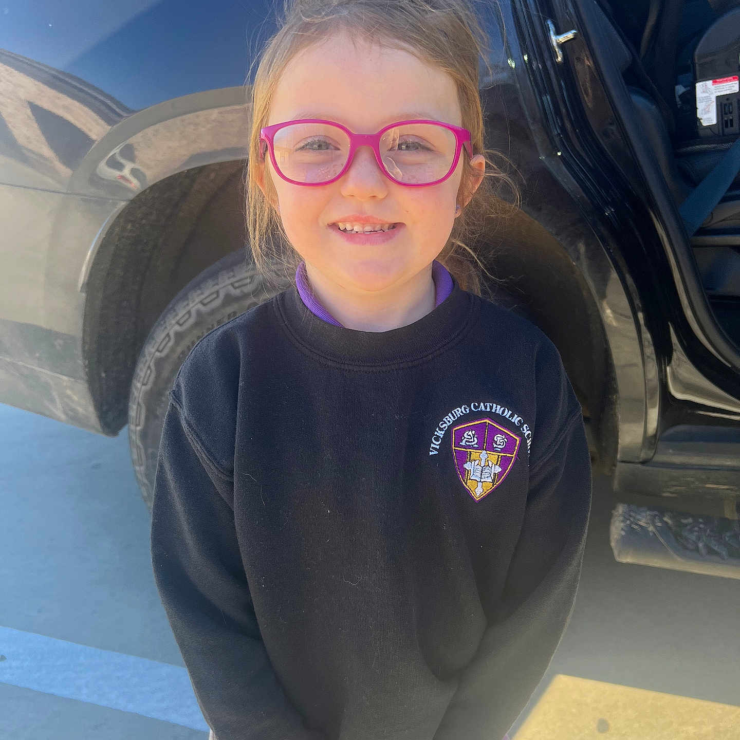 Leighton joined the competition — help win amazing prizes! alloywheel, car, carwheel, clothing, coat, face, head, knitwear, longsleeve, machine, person, photography, portrait, sleeve, spoke, sweater, tire, transportation, vehicle, wheel