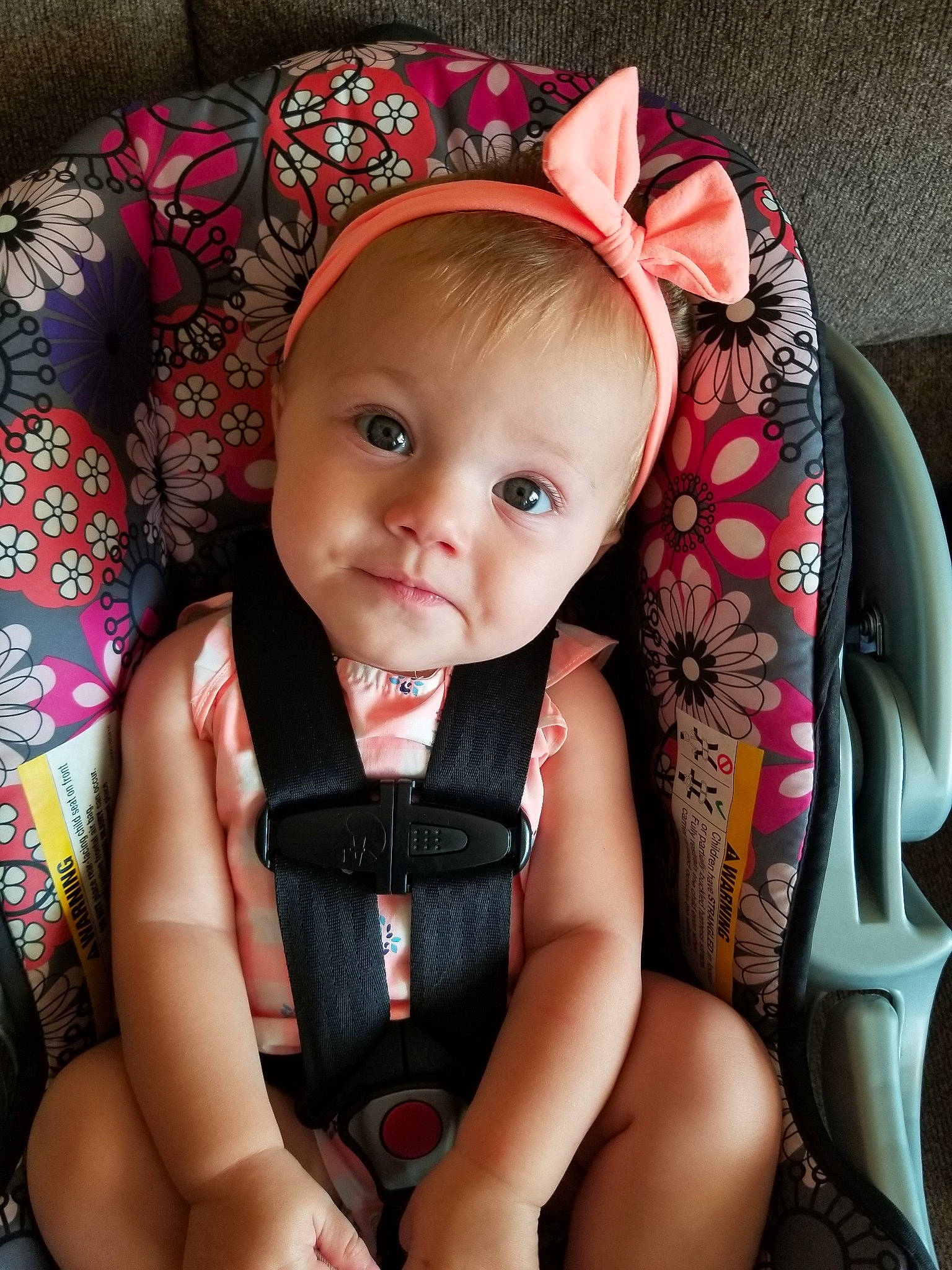 Caydence is registered to the contest to win money with this photo: baby, car_seat, cheek, child, ear, eye, face, head, headgear, iris, leg, lip, mouth, person, photography, pink, product, sitting, skin, smile