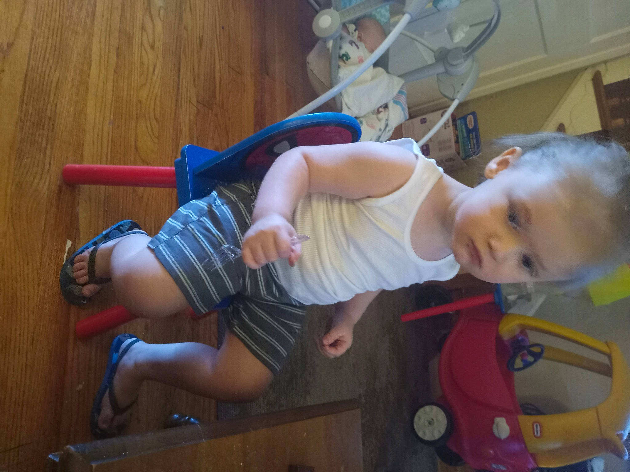 Man Man joined the competition — help win amazing prizes! baby, baby_products, baby_safety, baby_toddler_clothing, baby_toys, child, flooring, fun, hat, human_leg, knee, leisure, person, play, room, sitting, t_shirt, thigh, toddler, wood