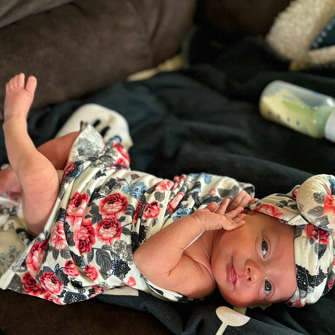 Emma Wyatt is registered to the contest to win money with this photo: baby, blanket, bodypart, bonnet, cap, clothing, couch, face, finger, furniture, hand, happy, hat, head, newborn, person, photography, portrait, quilt, smile