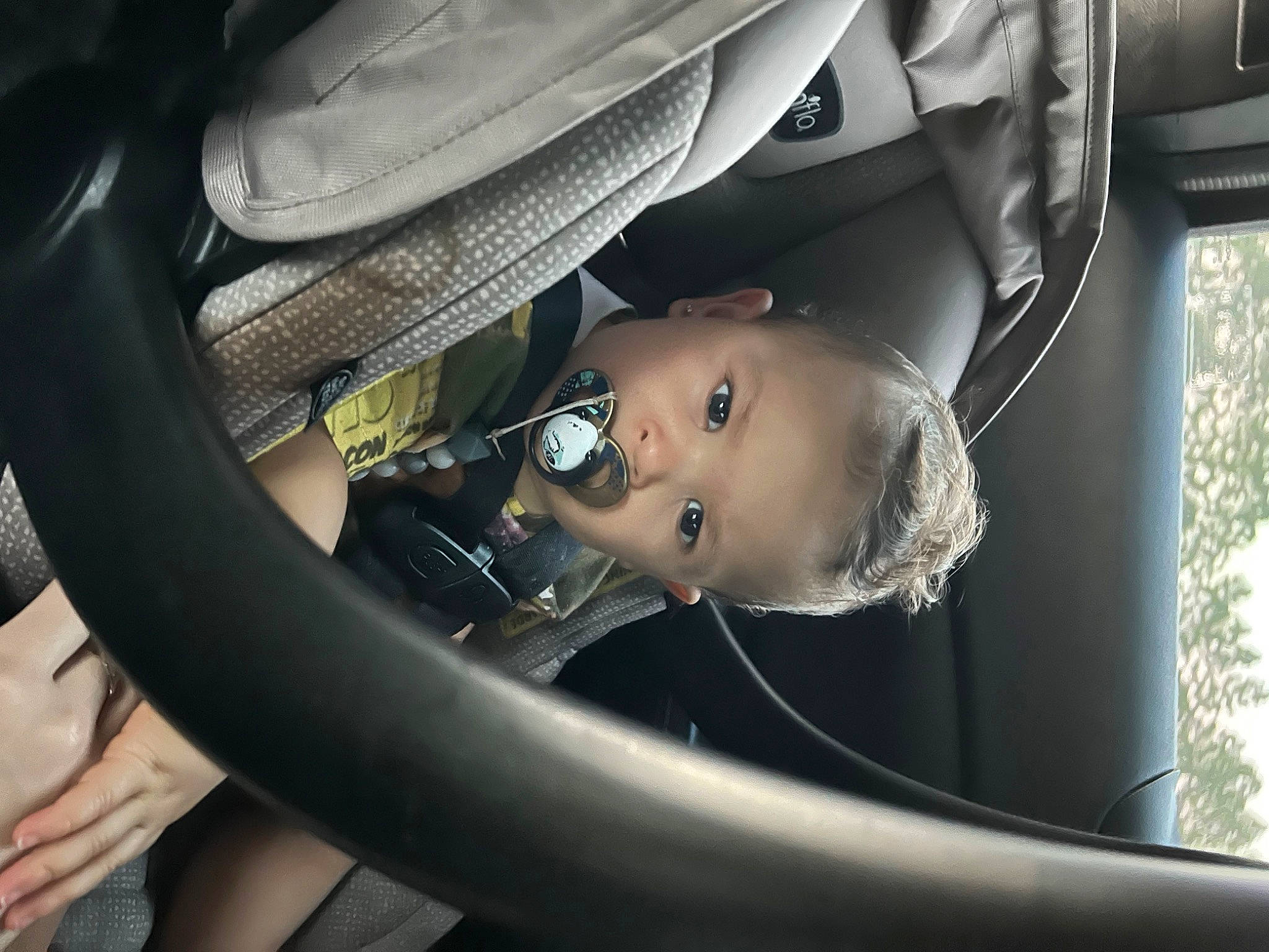 Adriel is registered to the contest to win money with this photo: auto_part, automotive_design, automotive_exterior, automotive_lighting, automotive_tire, baby, baby_carriage, car_seat, comfort, flash_photography, hand, helmet, motor_vehicle, person, personal_protective_equipment, plant, sunglasses, tire, toddler, vehicle_door