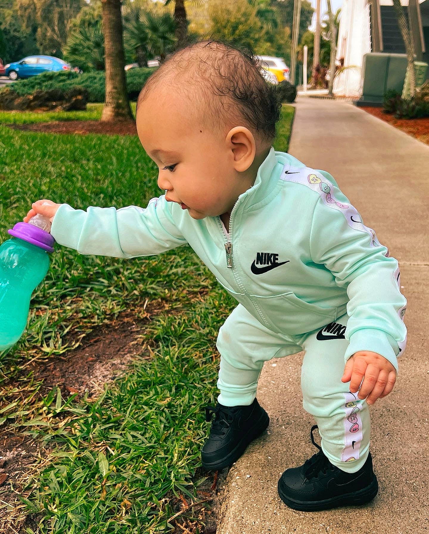Ariella joined the competition — help win amazing prizes! baby, baby_toddler_clothing, child, flooring, fun, garden, grass, happy, lawn, leisure, people_in_nature, person, plant, plastic_bottle, recreation, sitting, sleeve, soil, toddler, tree