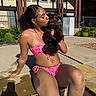 bikini, casual, daylight, dog, greenery, happy, kiss, outdoor, pet, poolside, puppy, relaxation, residential_building, skin, summer, sunlight, swimwear, tattoo, water, woman