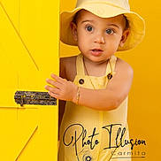 Christopher is registered to the contest to win money with this photo: toddler, child, yellow, door, hat, overalls, curious, portrait, studio, baby, cute, peeking, expression, skin, hand, face, clothing, fashion, indoors, bright