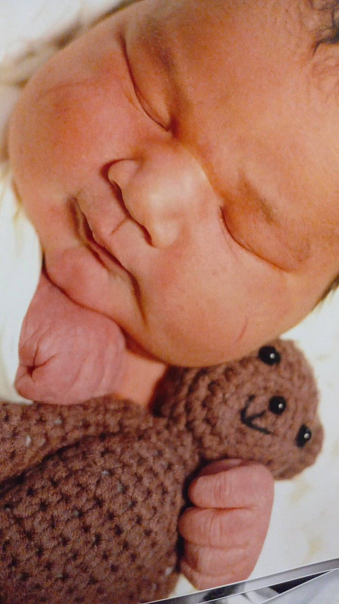 Aaron is registered to the contest to win money with this photo: baby_sleeping, cheek, child, comfort, eyelash, finger, fur, gesture, hand, mammal, nail, nose, person, skin, textile, thumb, toddler, toy, wool, woolen