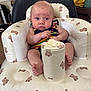 Rowan joined the competition — help win amazing prizes! baby, infant, child, seat, inflatable_seat, teddy_bear_pattern, container, wipes, striped_clothing, colorful, indoor, furniture, curious_expression, barefoot, skin, head, legs, arm, person, closeup