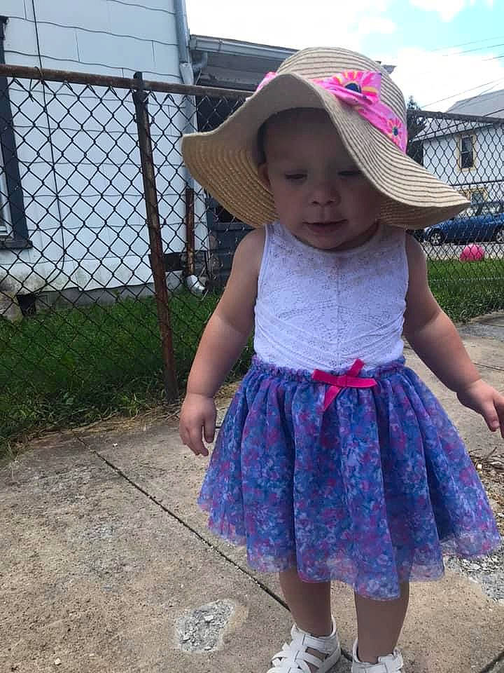 Azura is registered to the contest to win money with this photo: baby, baby_toddler_clothing, child, electric_blue, fence, fun, grass, hat, headwear, human_leg, leisure, magenta, pattern, person, pink, plant, purple, sky, sun_hat, toddler