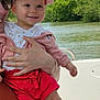 baby, child, smiling, cap, pink, white, red_shorts, outdoor, river, trees, greenery, adult, holding, boat, water, nature, sunlight, happy, person, summer