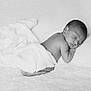 newborn, baby, sleeping, blanket, soft, white, portrait, black_and_white, peaceful, infant, resting, cute, child, toddler, indoors, cozy, face, skin, quiet, comfort