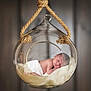 newborn, baby, sleeping, glass, orb, hanging, rope, soft, fluffy, blanket, portrait, peaceful, infant, skin, wrapped, cute, indoor, closeup, face, resting