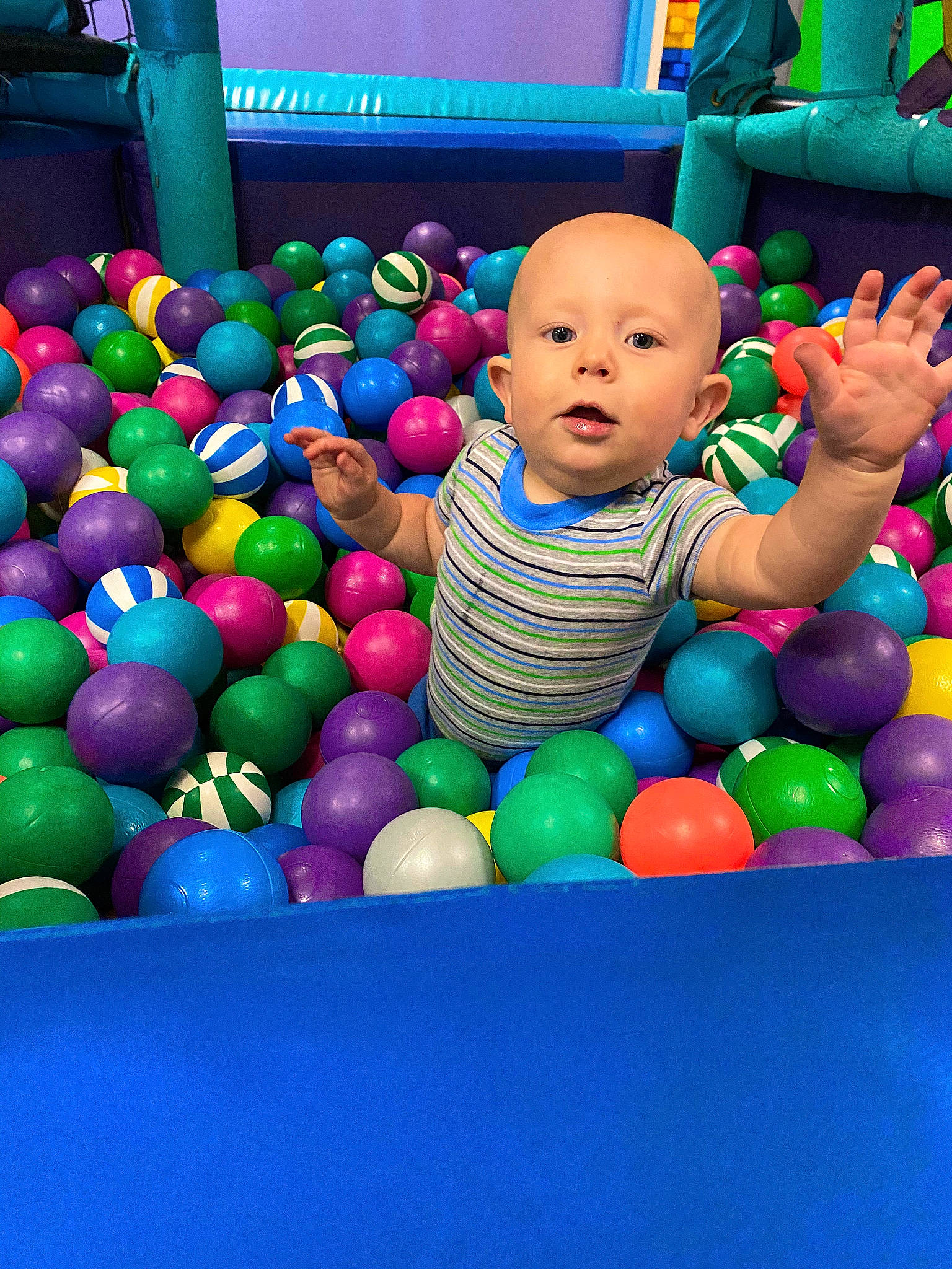 Paul is registered to the contest to win money with this photo: baby, baby_playing_with_toys, baby_products, baby_toys, ball, ball_pit, blue, child, electric_blue, event, fun, grass, leisure, person, plastic, play, recreation, room, sweetness, toddler