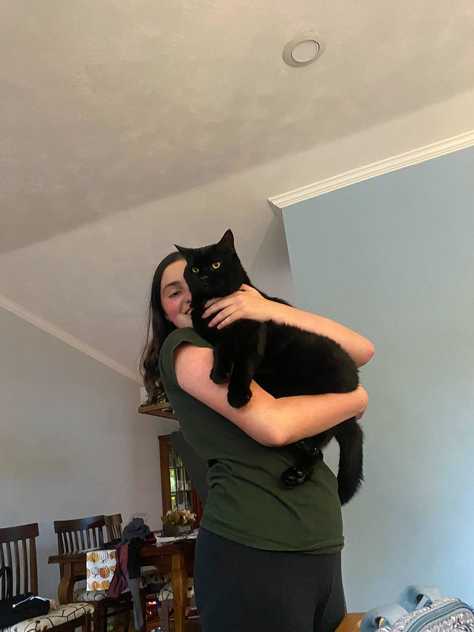 Herbie is registered to the contest to win money with this photo: abdomen, black_hair, ceiling, chair, costume, event, eyewear, fashion_accessory, fun, fur, grey, happy, helmet, light_fixture, long_hair, personal_protective_equipment, room, t_shirt, thigh, waist