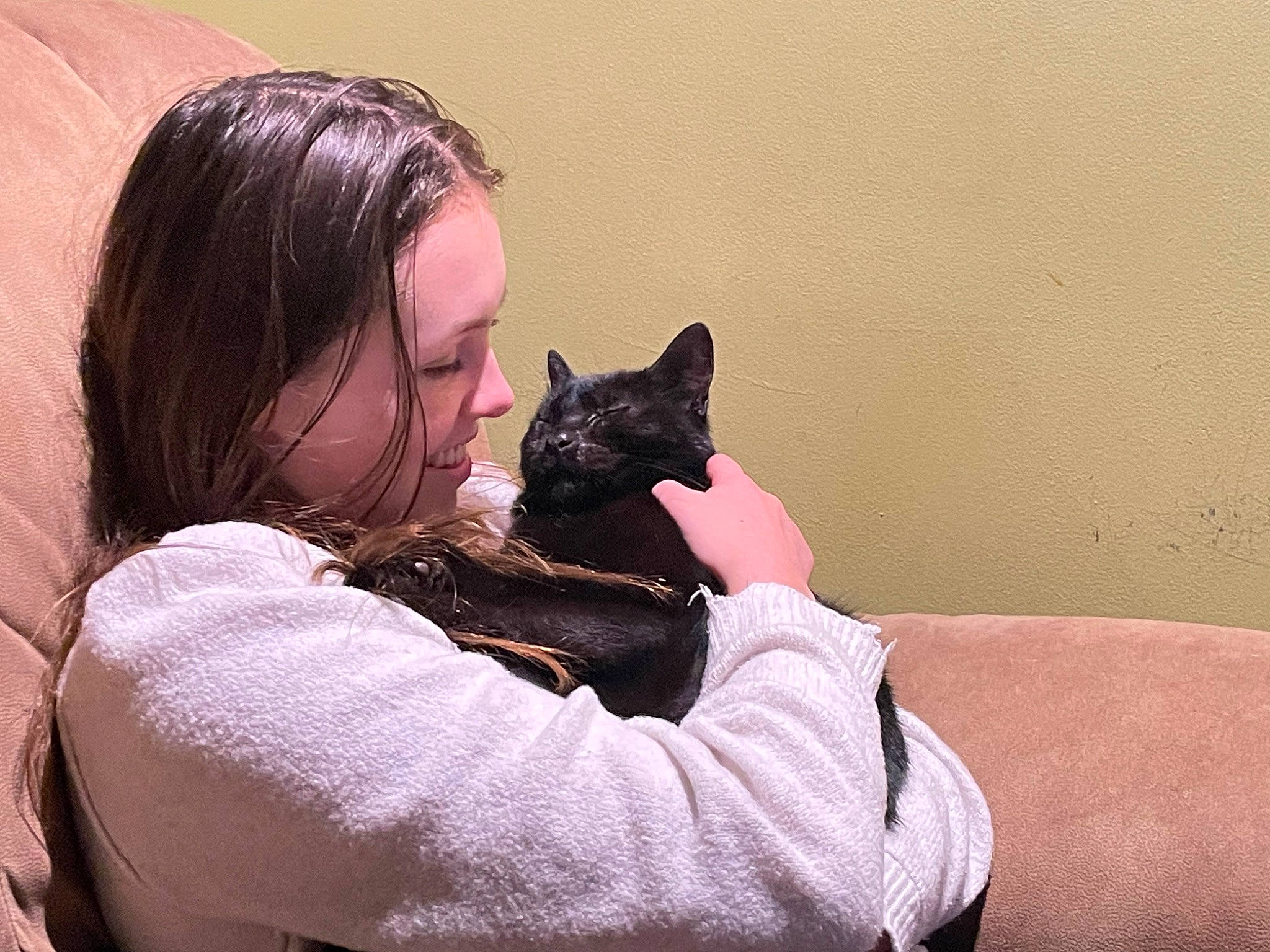 Andy is registered to the contest to win money with this photo: black_cat, black_hair, canidae, carnivore, cat, comfort, companion_dog, dog_breed, fawn, felidae, gesture, happy, long_hair, purple, skin, small_to_medium_sized_cats, smile, snout, tree, whiskers