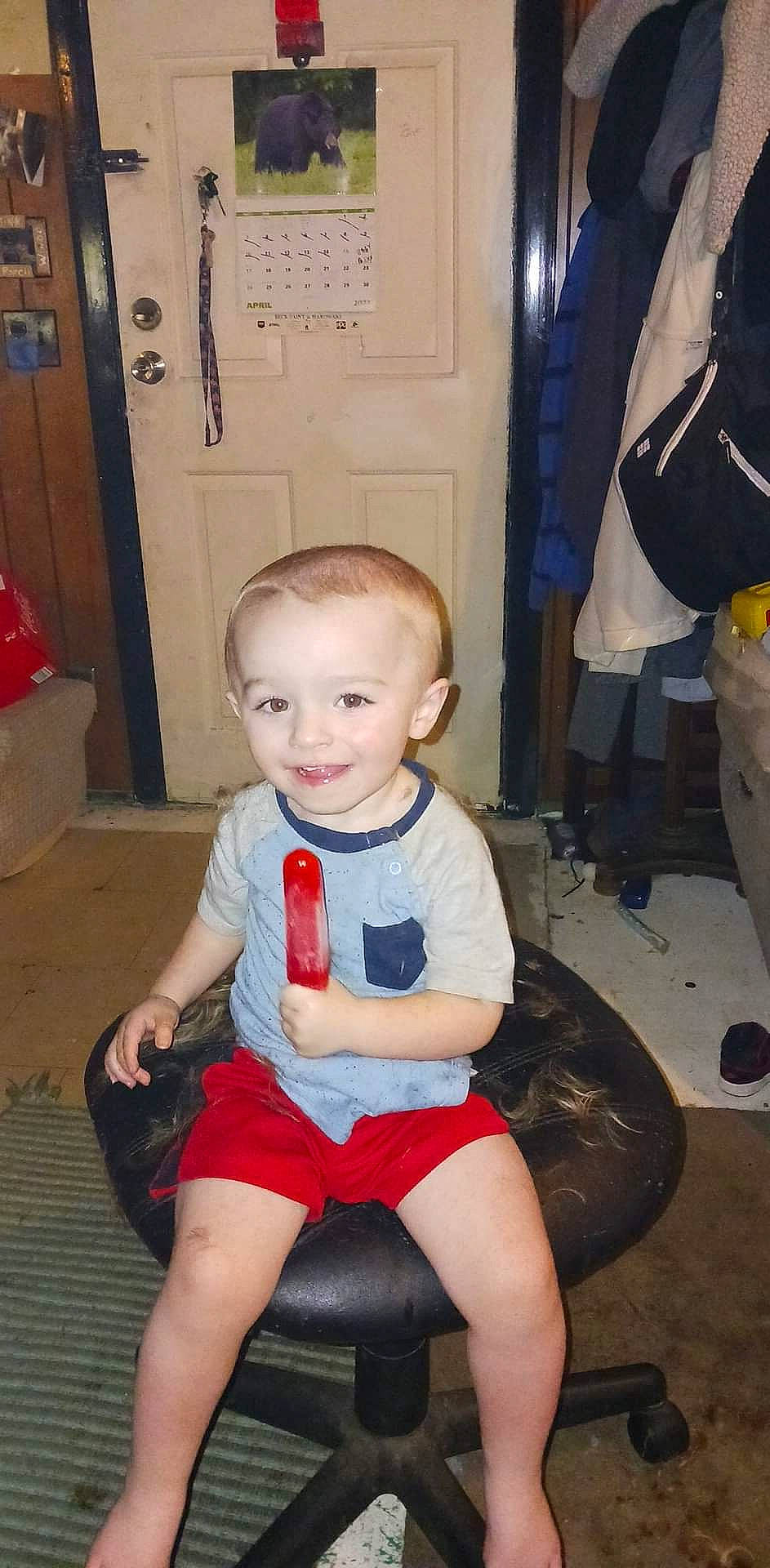 Harlan is registered to the contest to win money with this photo: baby_toddler_clothing, chair, child, door, electric_blue, flooring, fun, happy, human_leg, joint, joy, knee, lap, leg, mouth, person, shorts, smile, standing, thigh