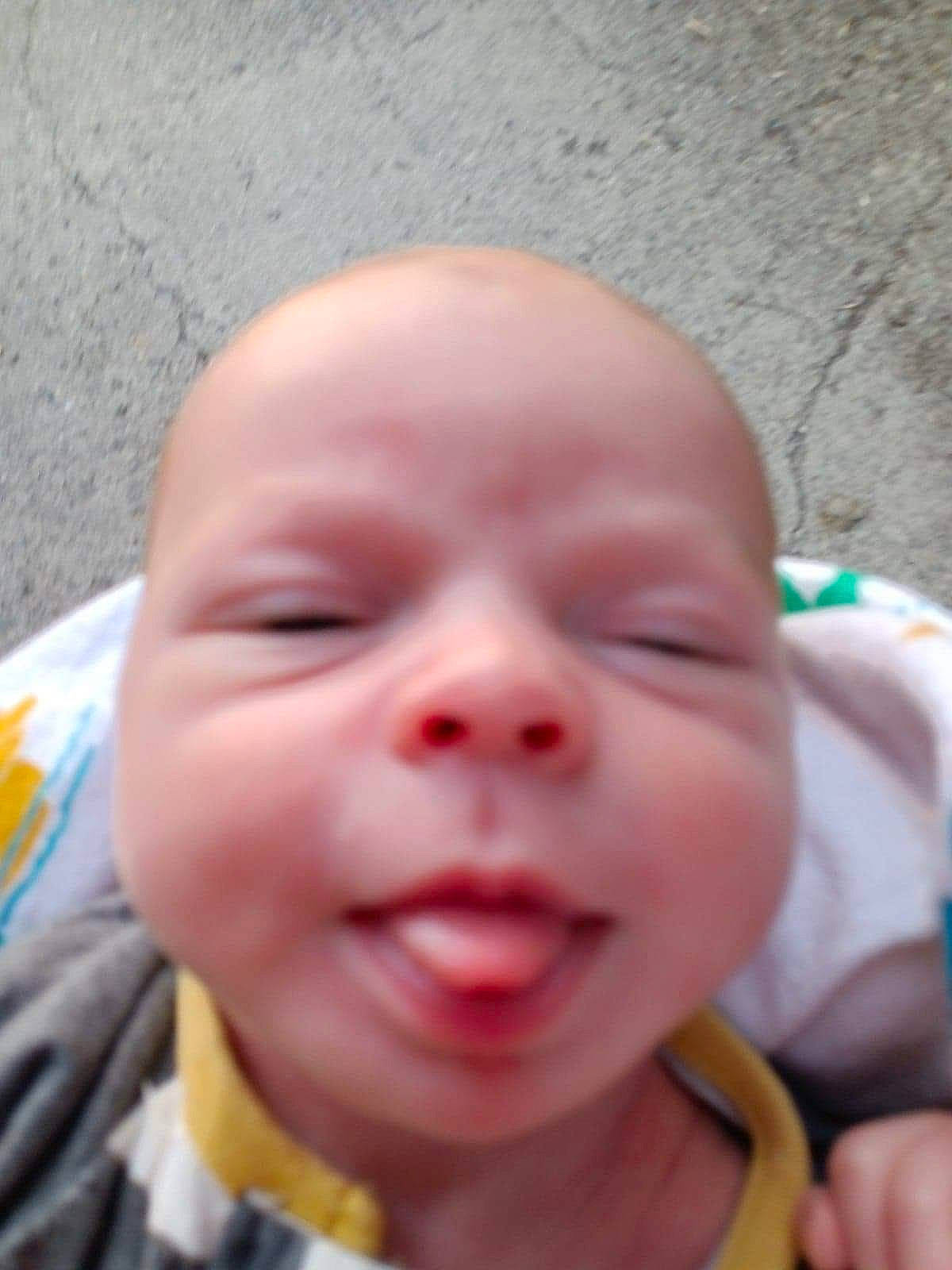 Timothy is registered to the contest to win money with this photo: baby, cheek, chin, ear, eye, eyebrow, eyelash, finger, forehead, gesture, happy, iris, jaw, lip, mouth, neck, nose, person, skin, smile