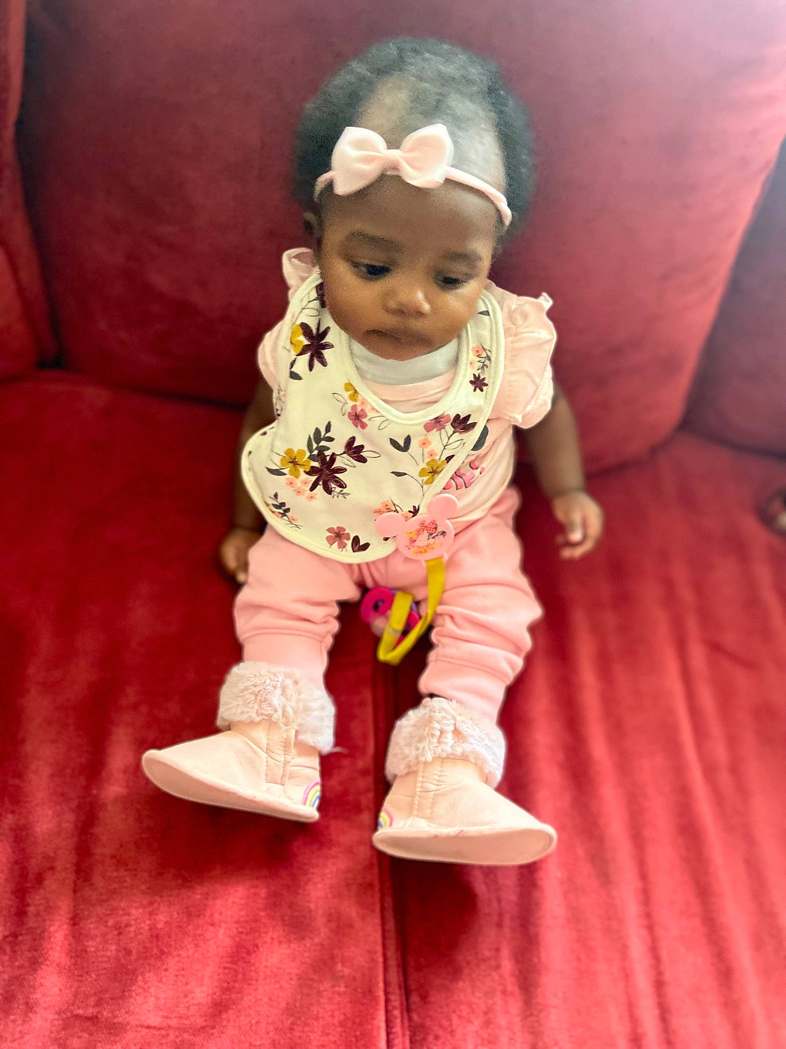 Laila is registered to the contest to win money with this photo: baby, baby_toddler_clothing, cheek, child, cool, face, facial_expression, fashion_accessory, fun, happy, head, magenta, nose, person, pink, purple, sitting, sleeve, smile, textile