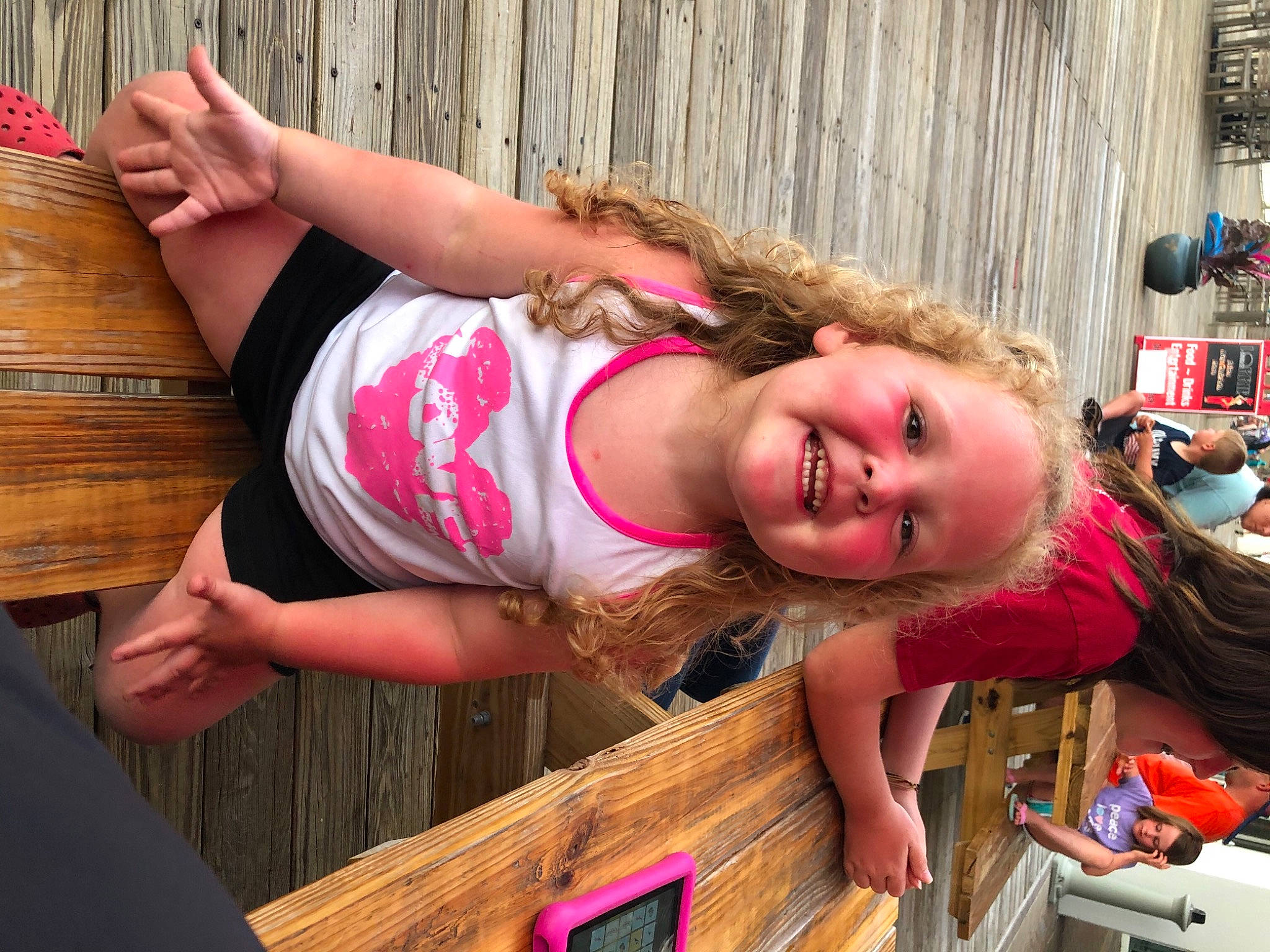 Emerie is registered to the contest to win money with this photo: baby_toddler_clothing, child, communication_device, folk_instrument, fun, gadget, happy, joy, leisure, mobile_phone, person, pink, plucked_string_instruments, portable_communications_device, spring, string_instrument, summer, thumb, toddler, vacation