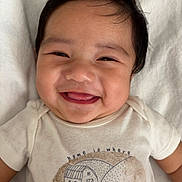 Kross joined the competition — help win amazing prizes! baby, smiling, infant, face, white_blanket, onesie, happy, cute, portrait, close_up, child, skin, hair, clothing, lying_down, expression, teeth, indoors, soft_texture, comfort