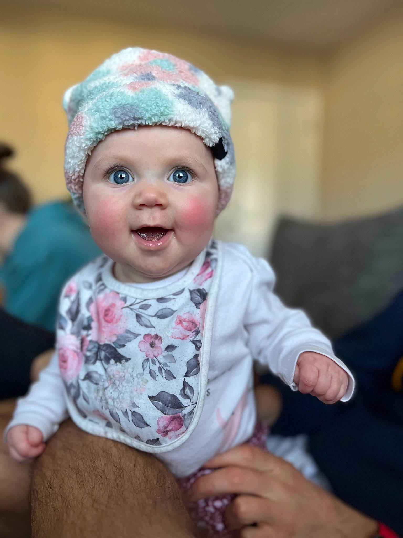 Parker is registered to the contest to win money with this photo: baby, baby_toddler_clothing, beanie, cap, cheek, child, eye, fashion_accessory, fun, fur, happy, headband, headpiece, headwear, iris, knit_cap, person, sitting, skin, sleeve