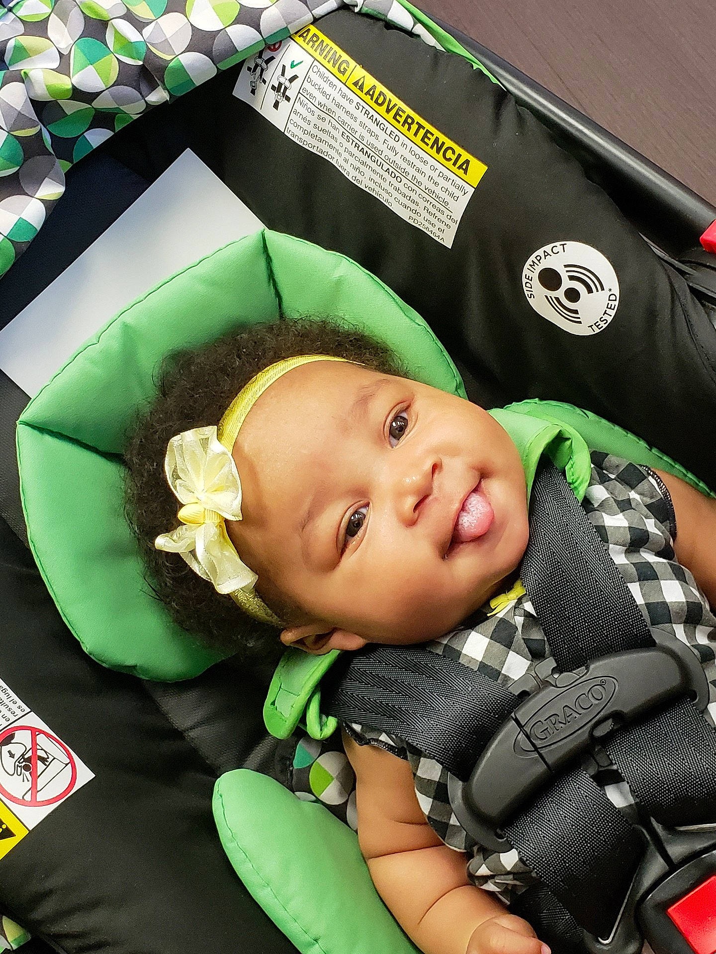 Emani joined the competition — help win amazing prizes! baby_carriage, car_seat, child, eye, green, infant, person, product, smile, toddler