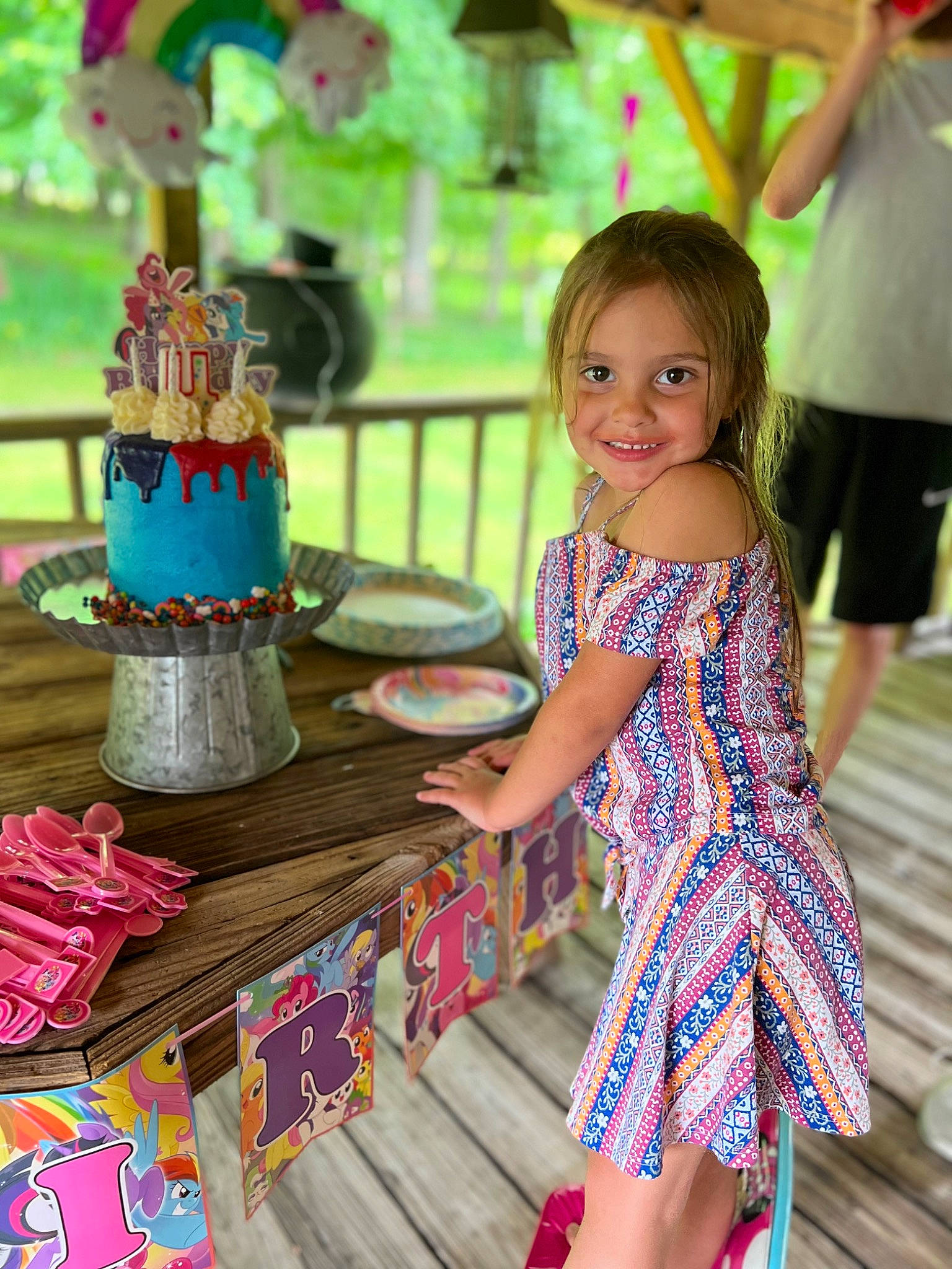Ashleigh is registered to the contest to win money with this photo: cake_decorating_supply, community, day_dress, dress, event, fun, green, happy, human, human_settlement, icing, joy, leisure, one_piece_garment, person, pink, public_space, recreation, summer, toddler