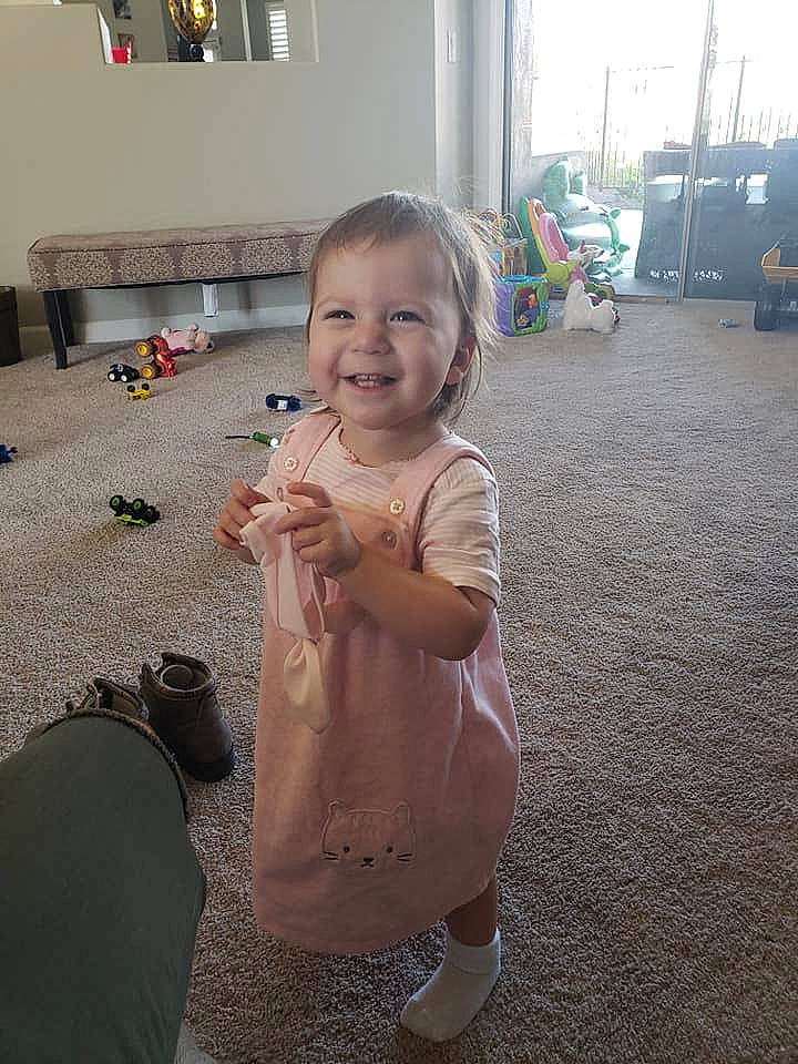 Kendall is registered to the contest to win money with this photo: baby, child, electronic_device, face, head, joy, person, play, skin, smile, technology, toddler, vacation