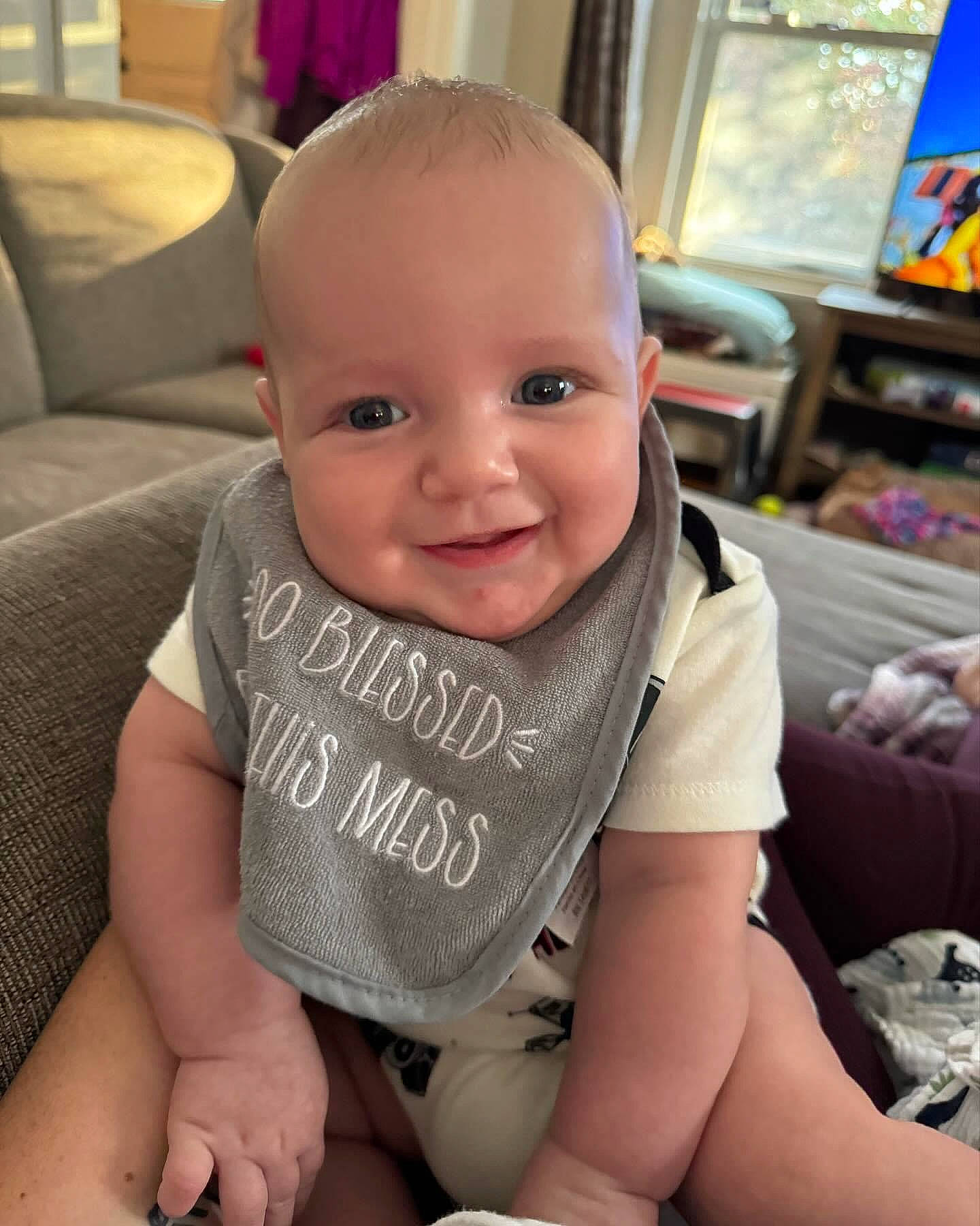 Aj is registered to the contest to win money with this photo: baby, baby_toddler_clothing, cheek, child, comfort, finger, fun, happy, human_body, human_leg, iris, joy, knee, person, product, sitting, skin, sleeve, smile, thigh