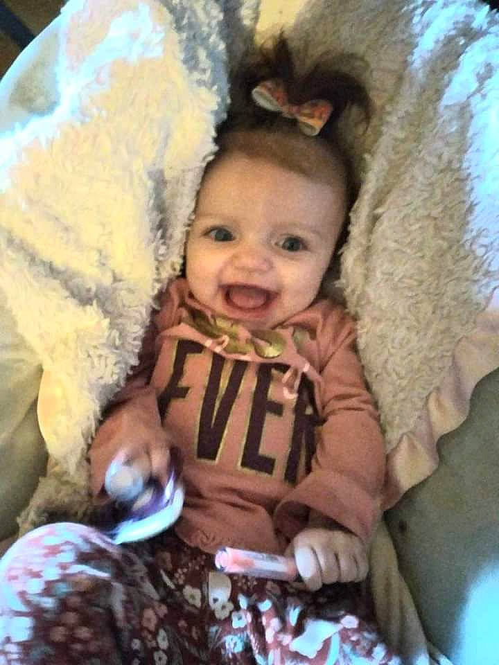 Oaklee is registered to the contest to win money with this photo: baby, baby_products, baby_toddler_clothing, cheek, child, comfort, fun, fur, happy, head, human_body, iris, jacket, nose, person, sitting, skin, smile, textile, toddler