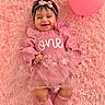 baby, child, pink, balloon, smile, dress, headband, sock, fluffy_rug, happy, portrait, one_year_old, cute, infant, lying_down, celebration, soft_texture, toddler, person, fun