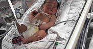 Josue is registered to the contest to win money with this photo: newborn, baby, incubator, hospital, medical_equipment, blanket, sleeping, infant, tube, healthcare, patient, bed, clothing, person, medicine, monitoring, care, neonatal, premature, resting