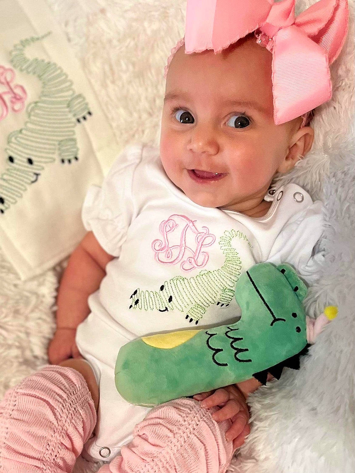 Summer Lee is registered to the contest to win money with this photo: baby, baby_toddler_clothing, cheek, chin, eye, face, facial_expression, happy, head, headwear, iris, mammal, organ, person, photograph, pink, product, skin, sleeve, smile