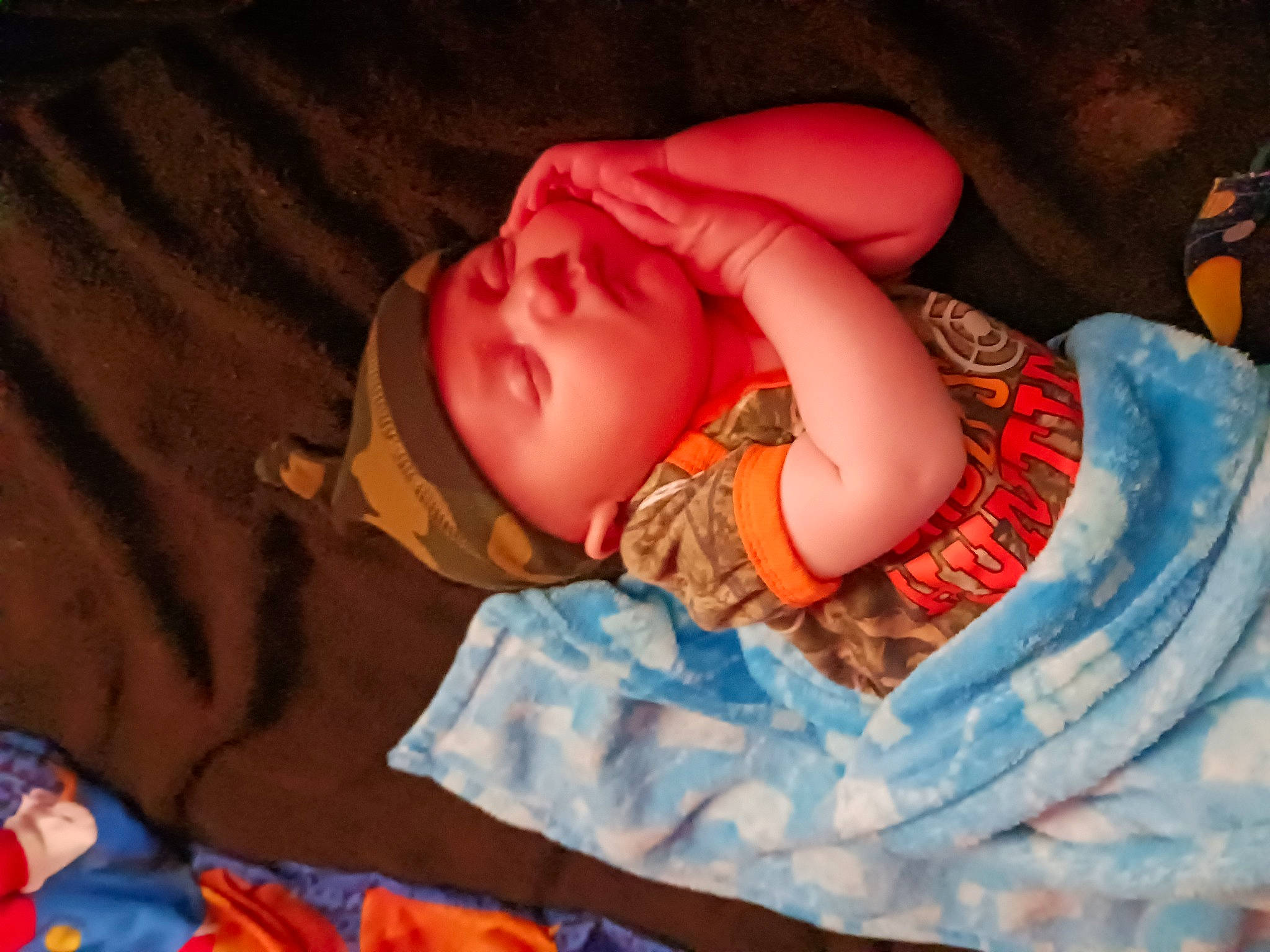 Kaiden is registered to the contest to win money with this photo: baby, baby_sleeping, baby_toddler_clothing, bedtime, cheek, child, comfort, finger, hand, head, headgear, headwear, human_body, linens, mouth, orange, person, product, skin, sleeve