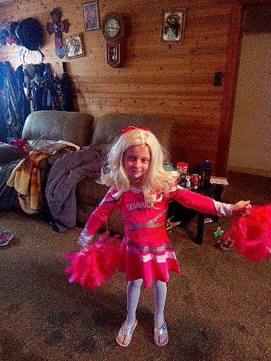 Patricia is registered to the contest to win money with this photo: child, event, fashion_accessory, fashion_design, fictional_character, flooring, fun, fur, happy, headgear, holiday, joy, magenta, mythical_creature, person, pink, purple, room, smile, textile