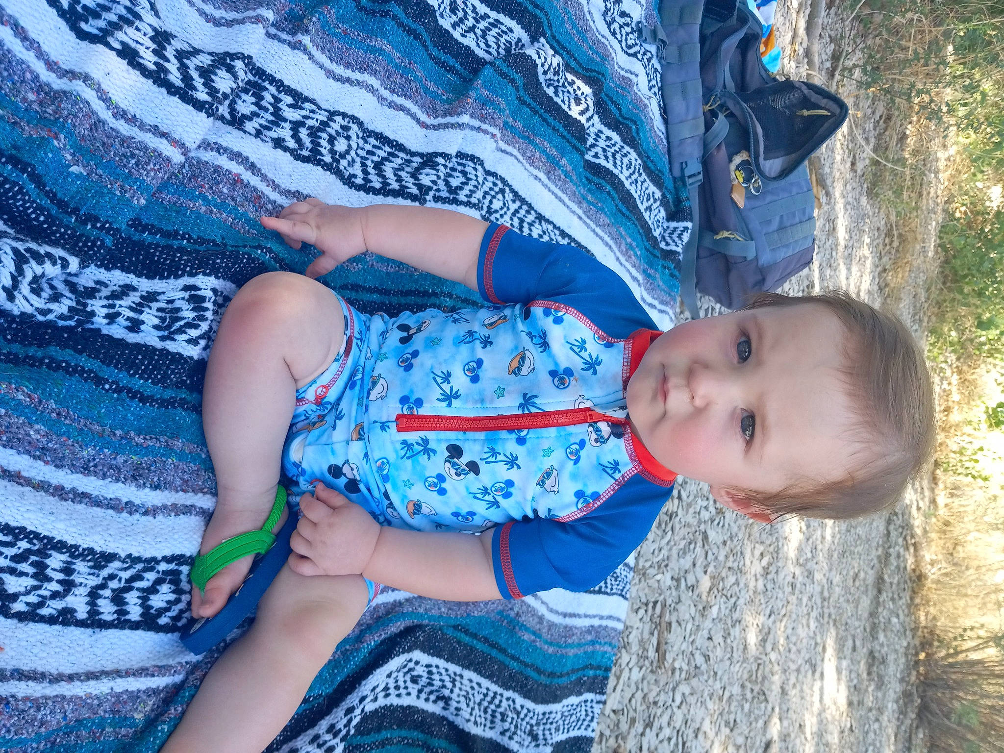 Danny is registered to the contest to win money with this photo: azure, baby, baby_toddler_clothing, beauty, blue, comfort, electric_blue, fun, grass, happy, human_body, leaf, leg, leisure, pattern, people_in_nature, person, plant, skin, toddler