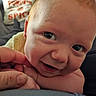 Erik joined the competition — help win amazing prizes! adult, baby, car, car_seat, child, close_up, curious, eyes, face, finger, hand, indoor, infant, photography, portrait, skin, smiling, travel, vehicle, yellow_clothing