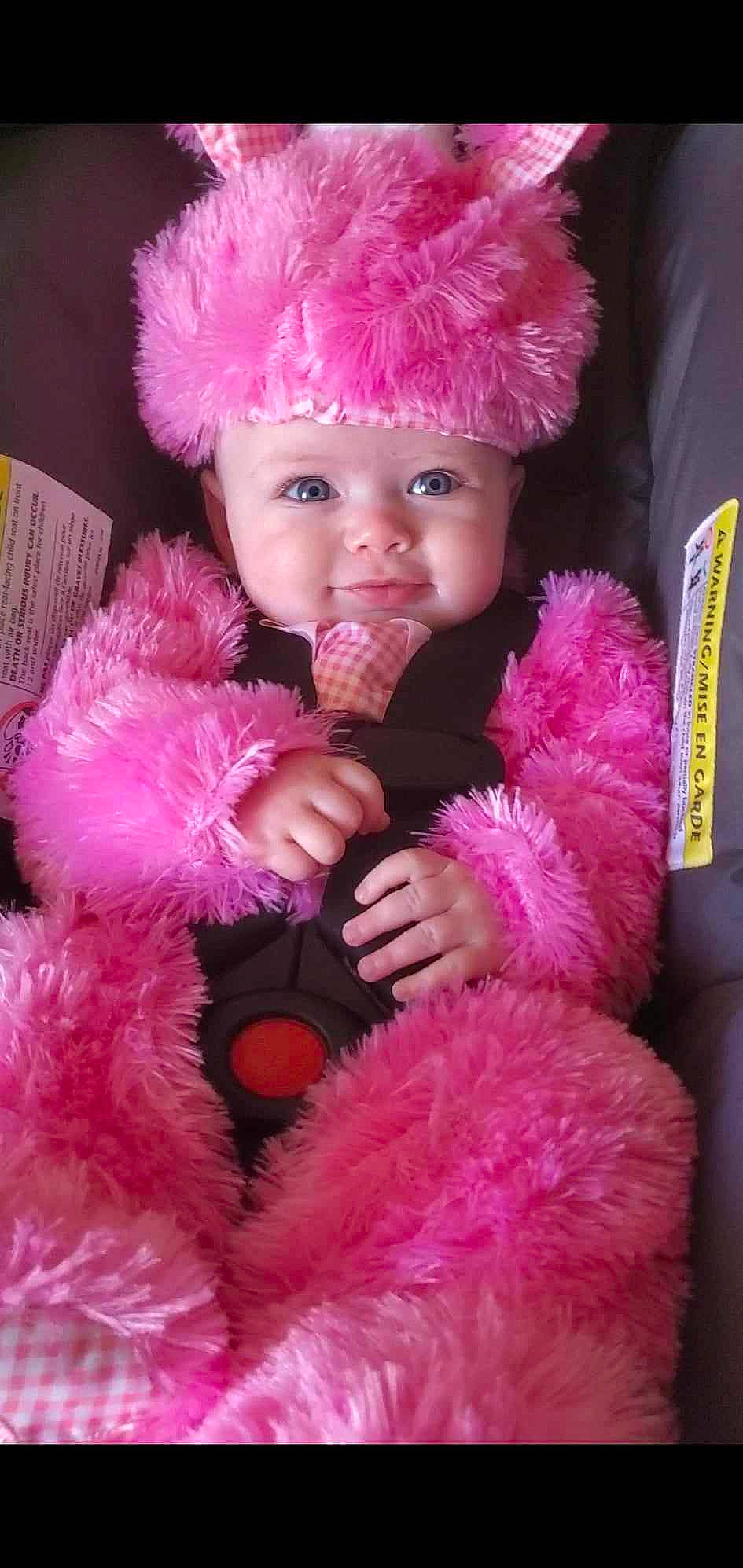 Kandyice is registered to the contest to win money with this photo: baby, baby_toddler_clothing, cap, child, costume_hat, event, fashion_accessory, fur, fur_clothing, gesture, happy, headgear, headwear, magenta, person, pink, plush, purple, skin, stuffed_toy