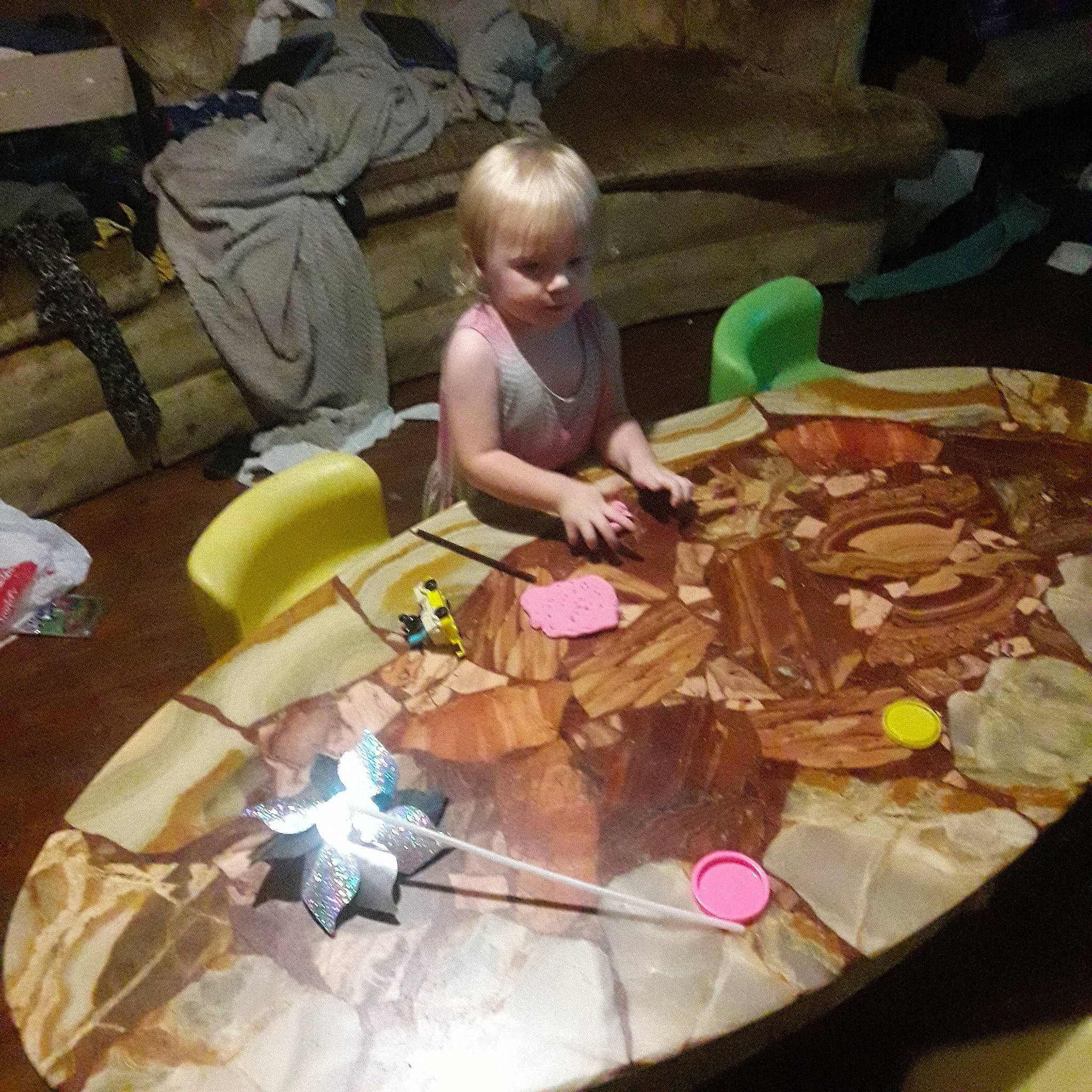 Eileen is registered to the contest to win money with this photo: art, baby, baby_products, chair, child, finger_food, flooring, fun, leisure, person, plastic, play, recreation, sharing, sitting, sweetness, table, toddler, toy, visual_arts