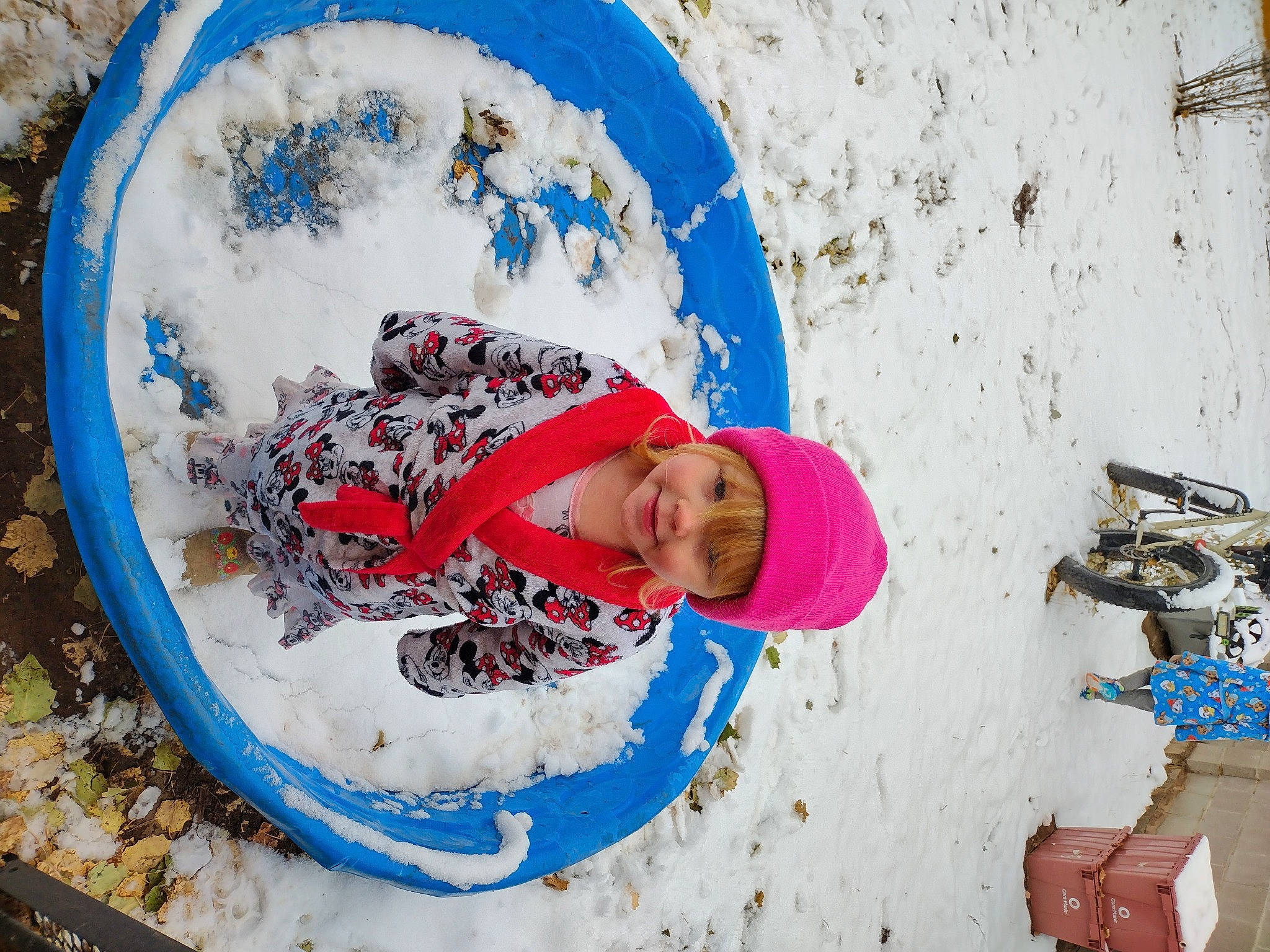 Eileen is registered to the contest to win money with this photo: azure, child, circle, freezing, fun, geological_phenomenon, happy, headgear, headwear, joy, leisure, paint, person, play, playing_in_the_snow, recreation, slope, snow, toddler, travel