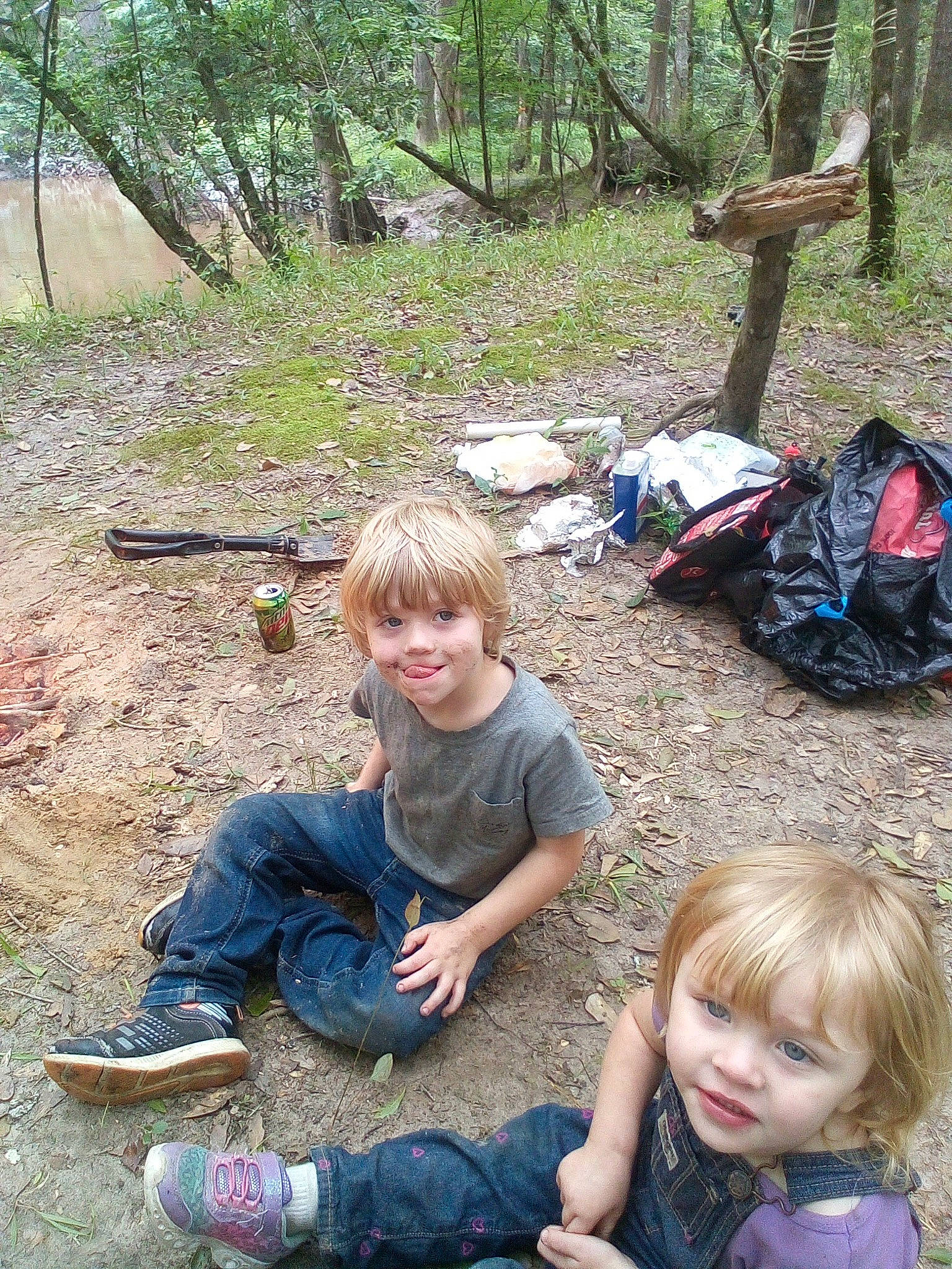 Josiah is registered to the contest to win money with this photo: botany, child, event, fun, grass, joy, leisure, mammal, people, people_in_nature, person, plant, recreation, sitting, smile, sneakers, soil, spring, summer, toddler