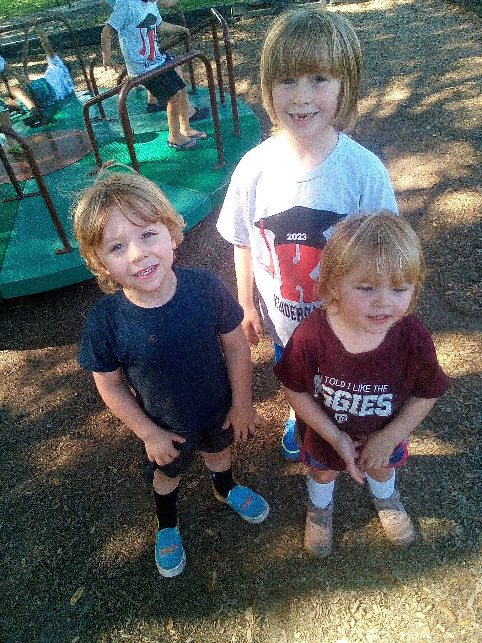 Josiah is registered to the contest to win money with this photo: community, cool, fun, grass, hairstyle, happy, head, joy, leaf, leisure, mammal, person, public_space, shoe, shorts, smile, social_group, style, summer, t_shirt