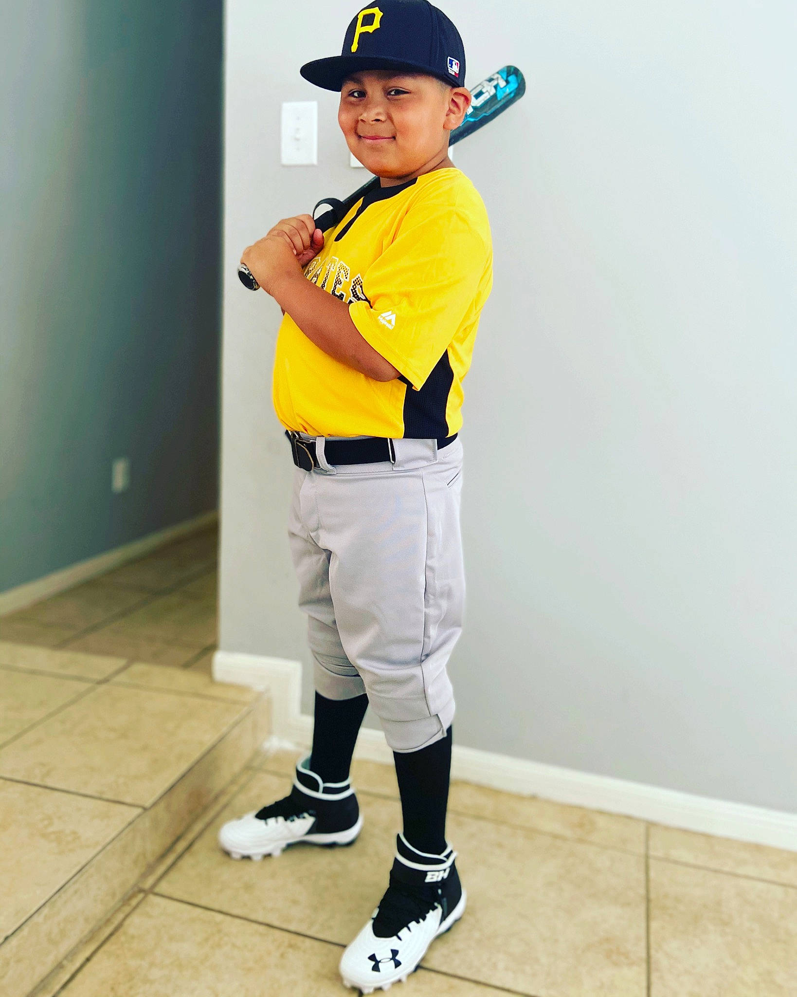 Armando is registered to the contest to win money with this photo: arm, baseball, baseball_bat, baseball_equipment, baseball_player, baseball_uniform, fashion_accessory, footwear, headwear, jersey, joy, person, personal_protective_equipment, player, shoe, sleeve, sports_equipment, sports_gear, sports_uniform, sportswear